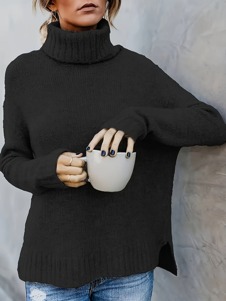 Casual women's cozy top: relaxed turtleneck sweater with side split hem, essential for cool weather.
