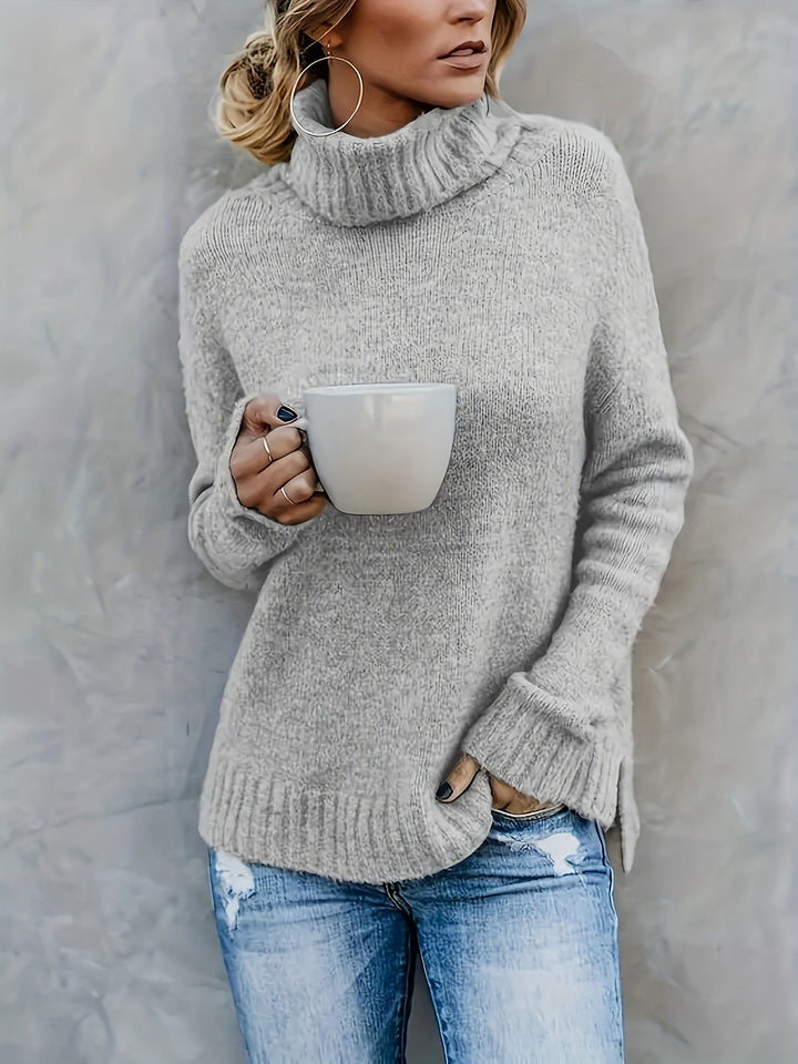Elegant women's long sleeve relaxed fit turtleneck, featuring a subtle side split hem for comfort.