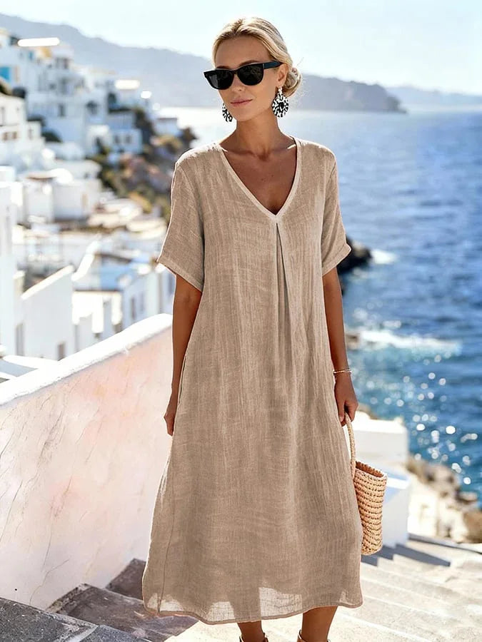 Women's versatile short sleeve V-neck midi dress, relaxed fit, ideal casual summer beach vacation wear.