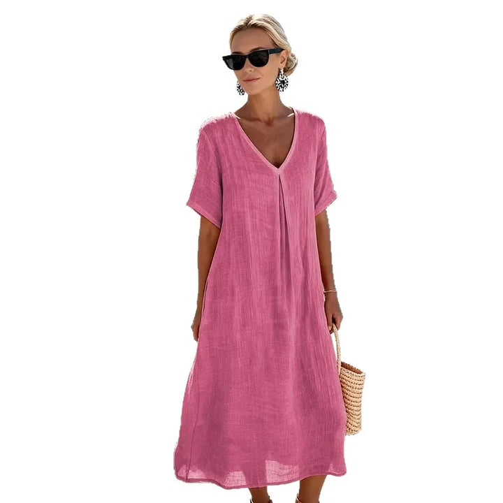 Black women's relaxed V-neck midi dress with short sleeves, comfortable and flowing for summer.