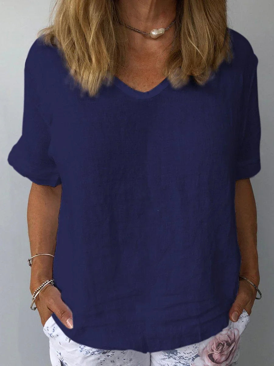 Women's relaxed V-neck short sleeve blouse, perfect for casual everyday wear in summer. Loose fit.