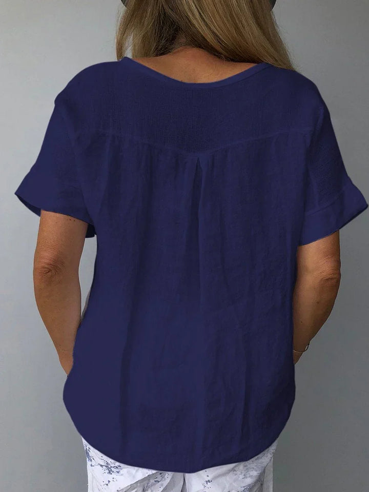 Versatile women's V-neck short sleeve blouse with relaxed fit, ideal for casual summer fashion or everyday wear.