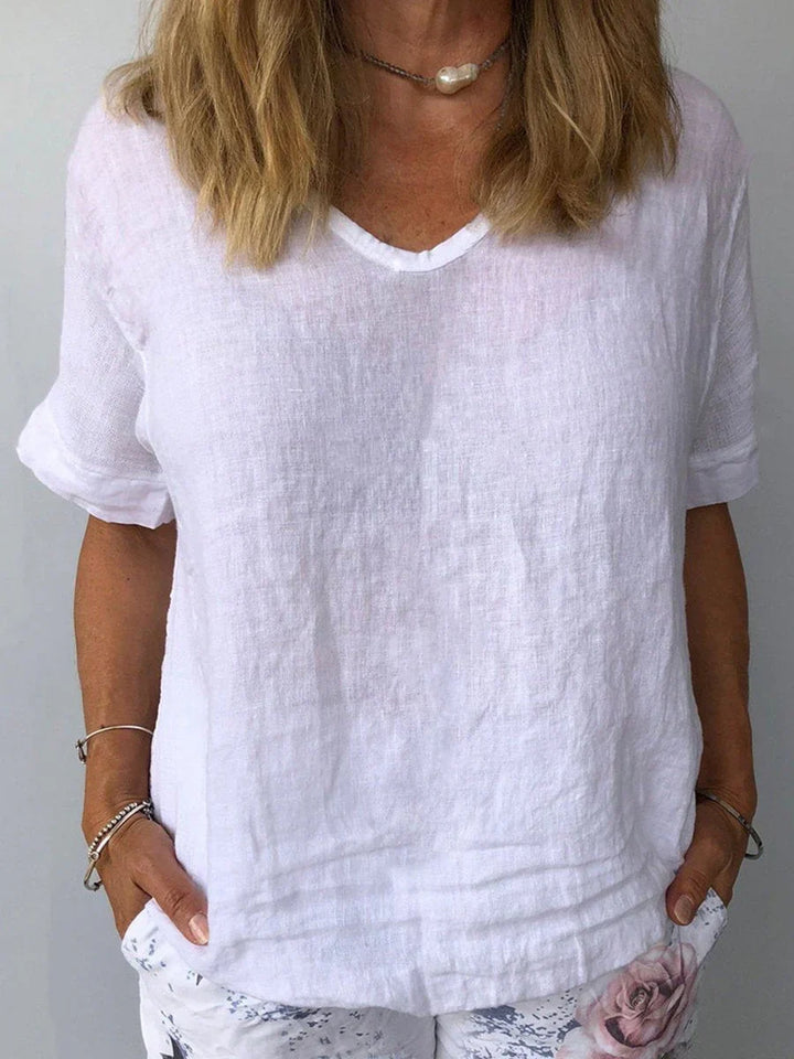 Women's casual short sleeve V-neck top, relaxed fit blouse for everyday and summer fashion. Loose and comfy.