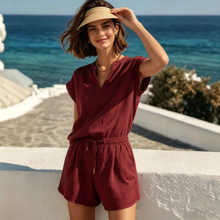 Chic women's two-piece outfit: V-neck top & relaxed drawstring shorts set. Ideal for summer vacation & casual style.
