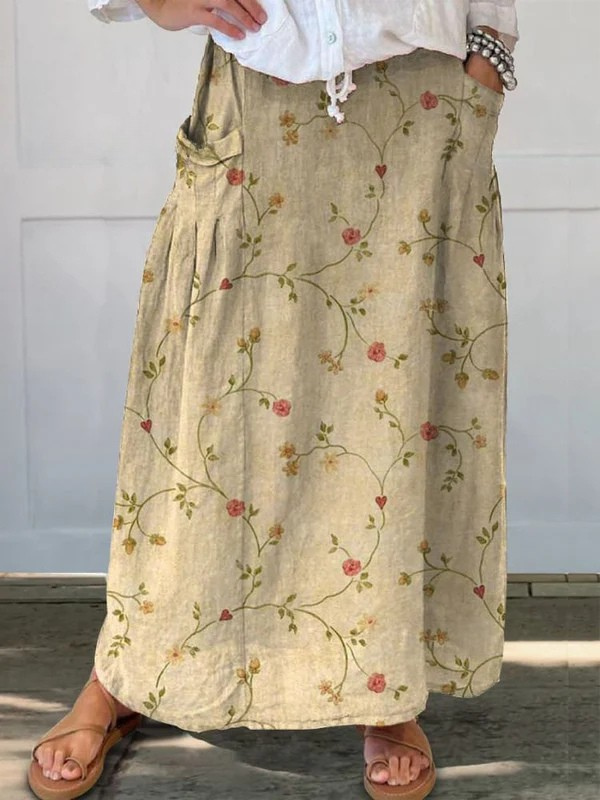 Women's retro beige floral art A-line midi skirt with elastic waist and pockets for casual everyday wear.