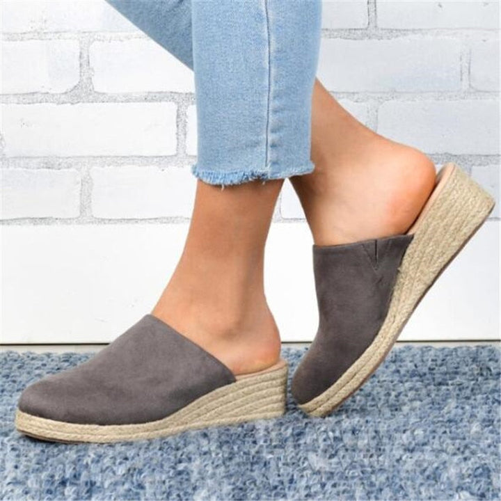 Stylish women's slip-on wedge sandals, embracing a retro summer vibe.