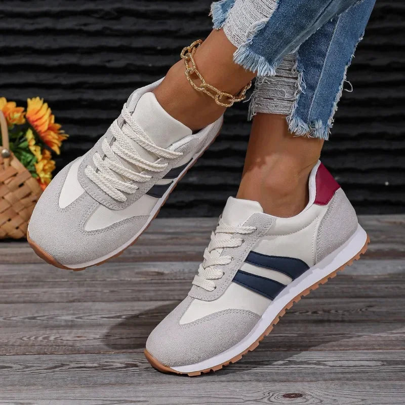 Fashionable women's retro stripe colorblock lace-up sneakers. Versatile casual shoes for a chic athletic aesthetic.