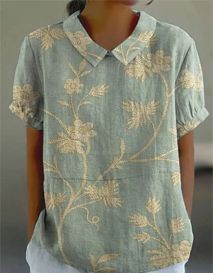Women's retro floral embroidered top, short sleeve, breezy summer style.