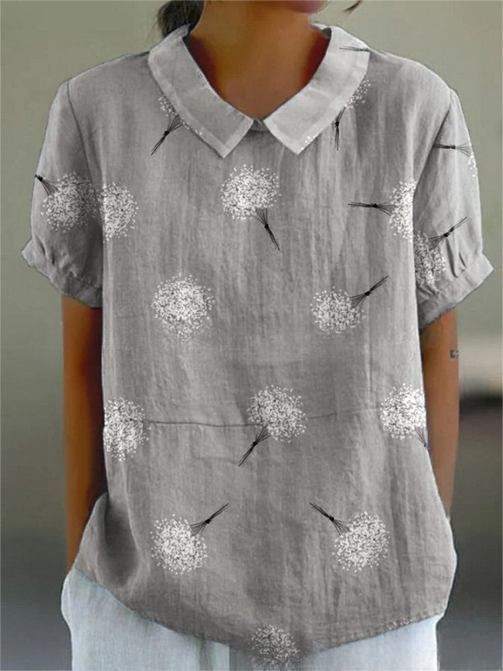 Delicate floral embroidered women's top, retro design, short sleeve, perfect for warm weather.