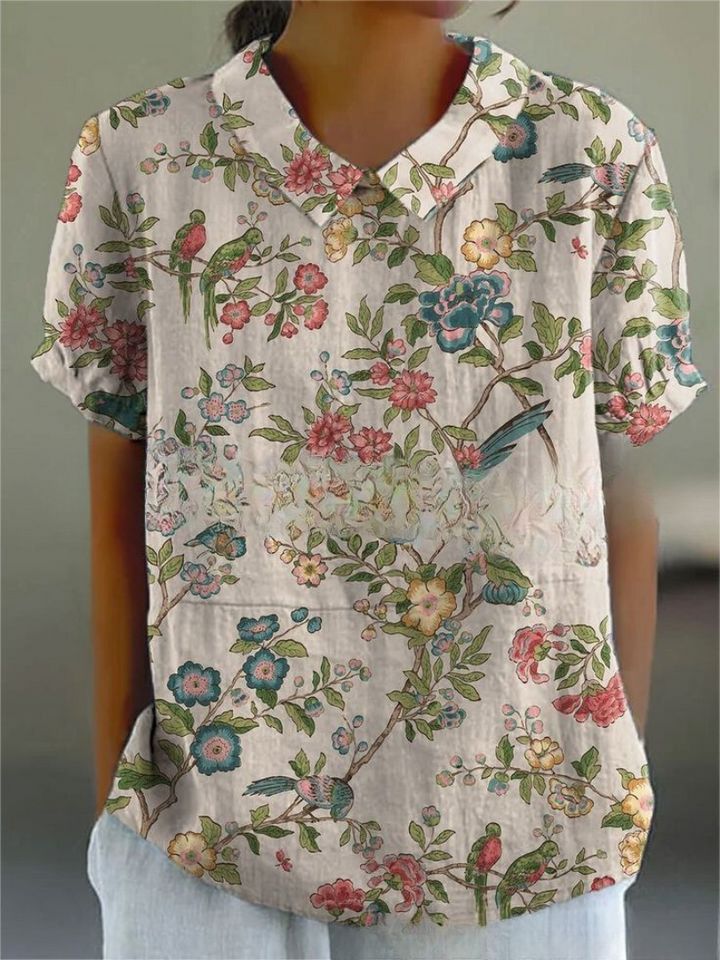 Chic women's retro floral embroidered top, short sleeve, versatile for summer fashion.