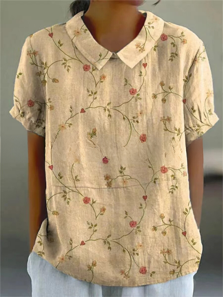 Breezy women's floral embroidered casual top, short sleeve, great for summer fashion.