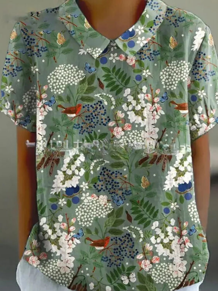 Casual women's short sleeve floral embroidered blouse, collared, perfect for summer.