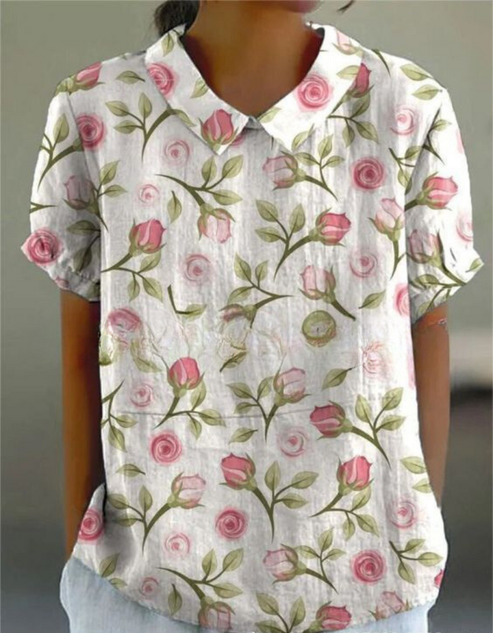 Vintage style women's floral embroidered top, short sleeve, elegant & comfortable for warm days.
