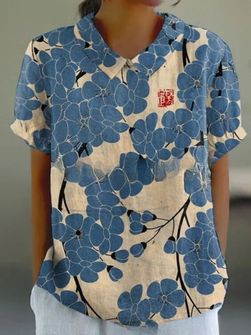 Summer women's top with retro floral embroidery, short sleeve, breezy and stylish comfort.