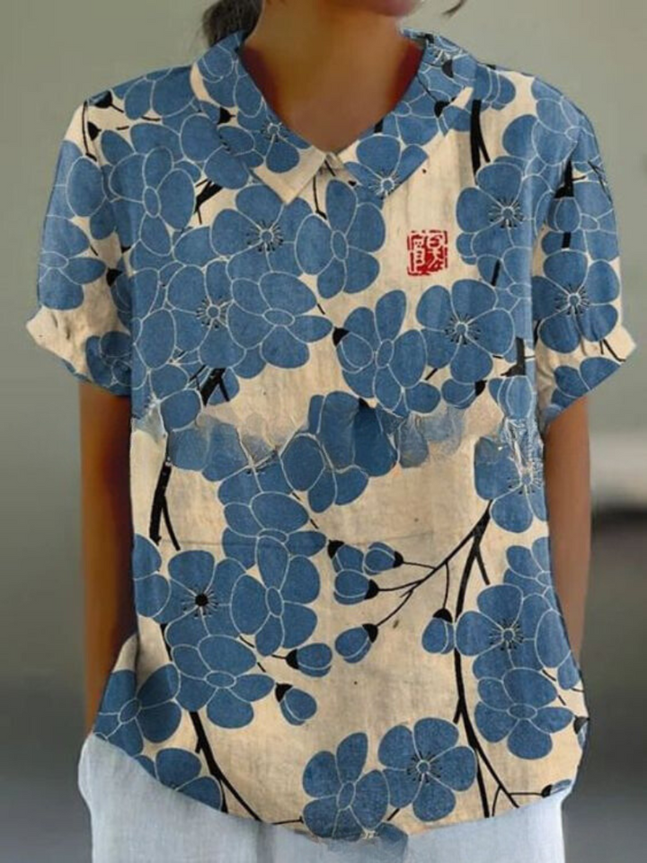 Summer women's top with retro floral embroidery, short sleeve, breezy and stylish comfort.