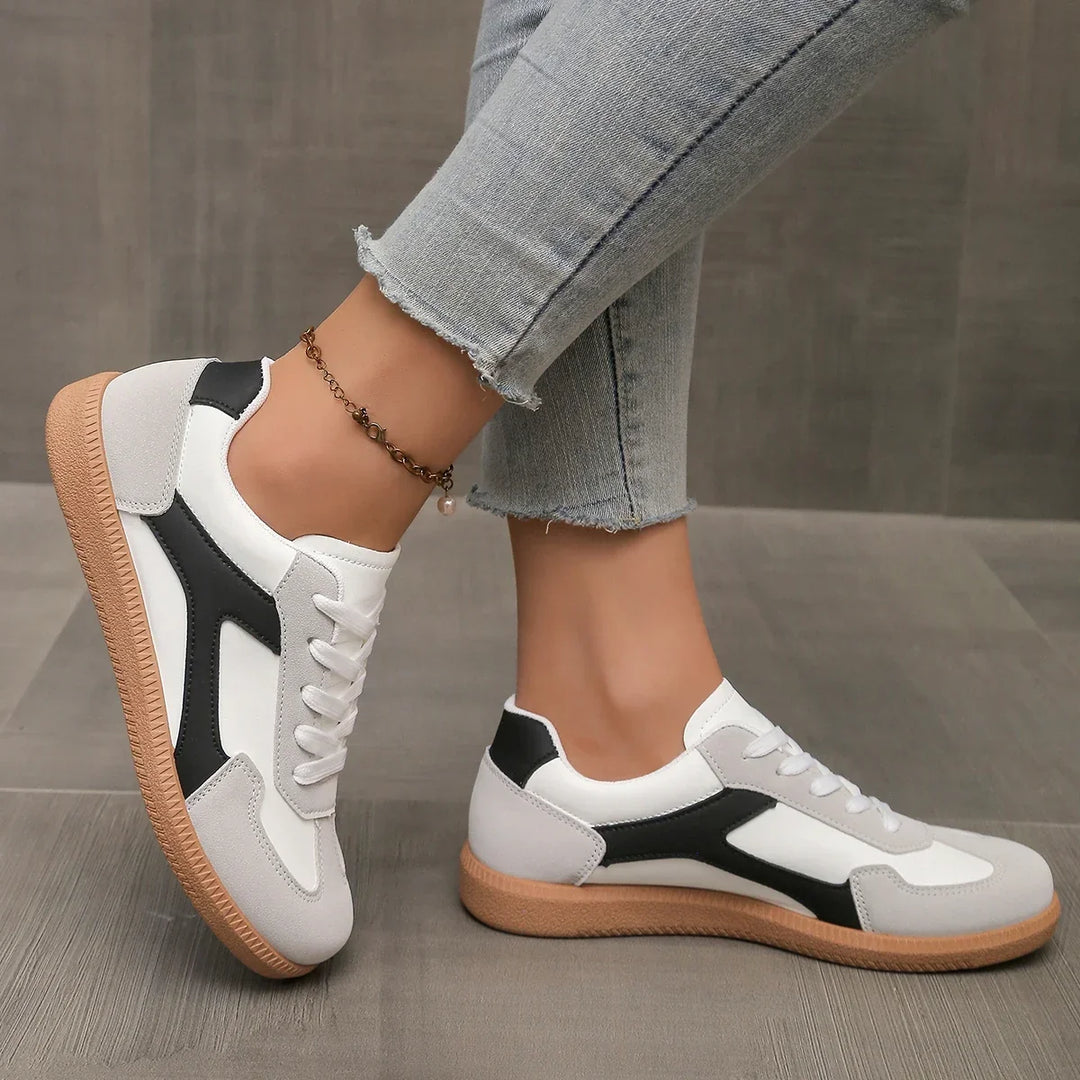 Stylish women's retro sneakers with a durable gum sole, low-profile design, and cushioned footbed.
