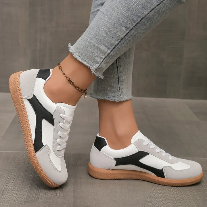 Stylish women's retro sneakers with a durable gum sole, low-profile design, and cushioned footbed.