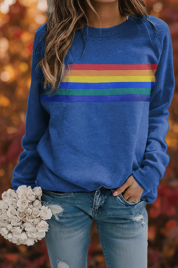 Everyday cozy comfort in a women's retro rainbow striped long-sleeve sweatshirt.