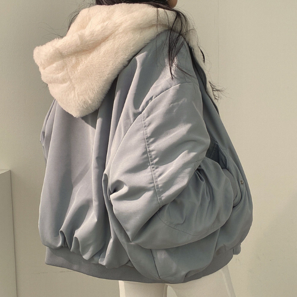 Versatile women's reversible hooded jacket for chic layered autumn fashion & cozy winter outings.