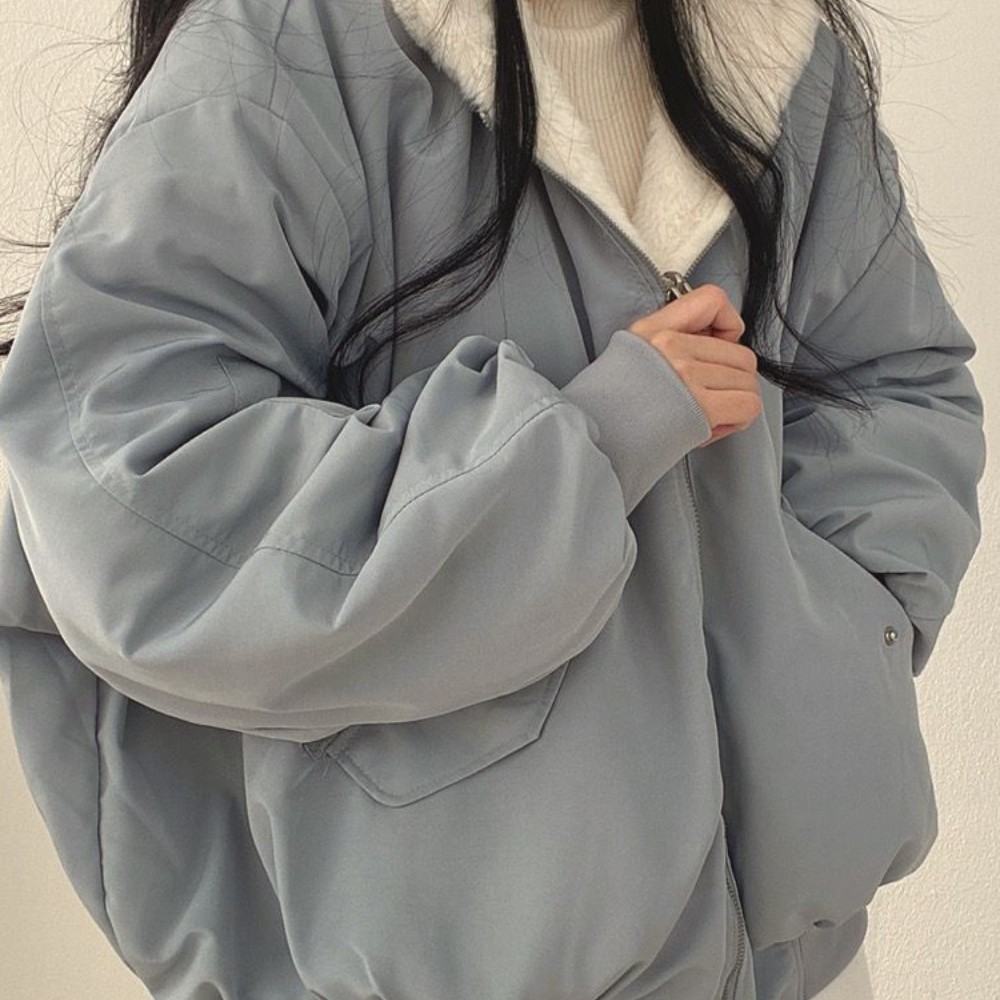 Cozy women's reversible hooded jacket for autumn strolls, winter warmth, and everyday casual style.