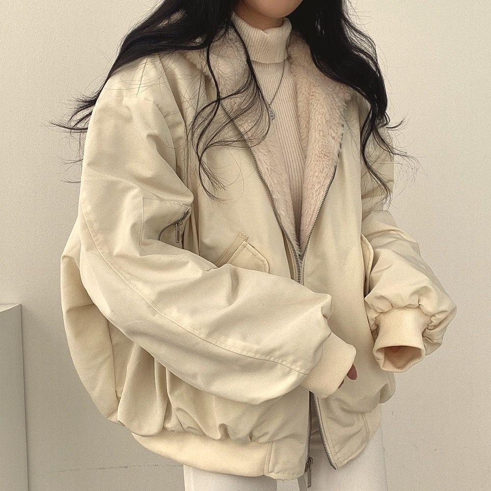 Layered women's reversible hooded jacket, cozy and versatile outerwear for cooler weather & travel.