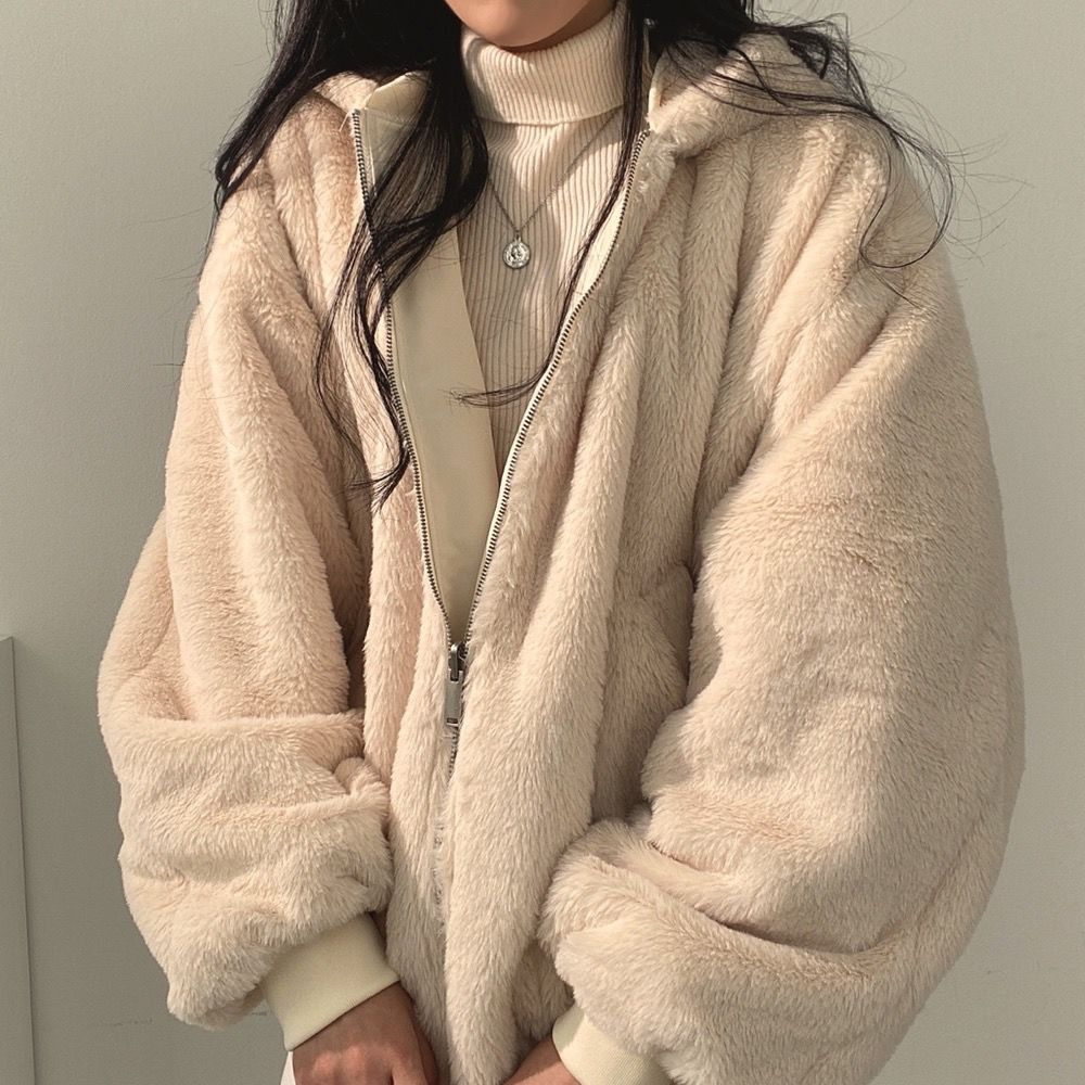 Two-in-one style: women's reversible hooded jacket offering versatile looks for cold weather chic.