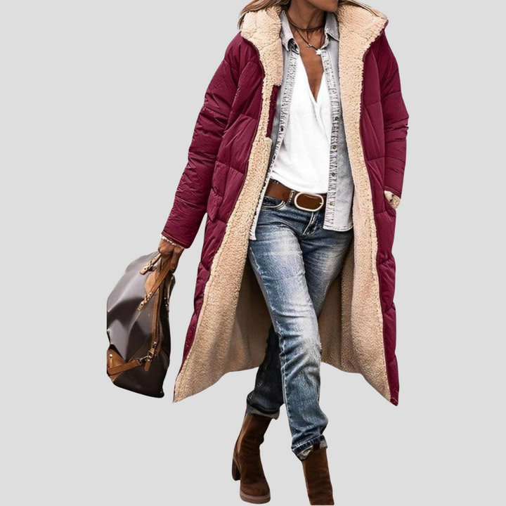Comfortable women's long hooded winter coat, cozy design ensures warmth and style in chilly conditions.