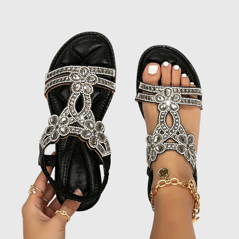 Glamorous women's flat sandals for summer vacation style.
