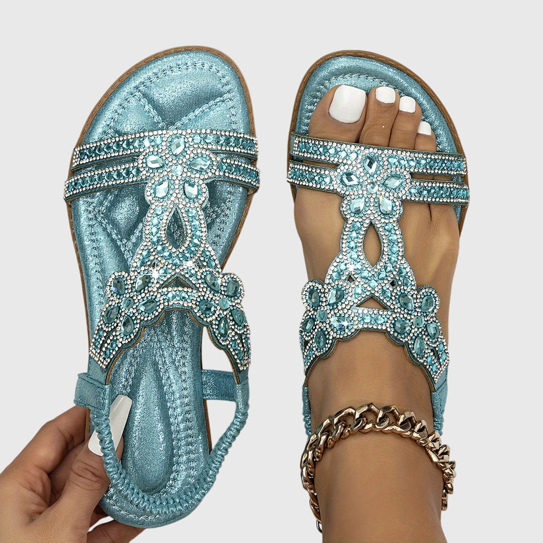 Glamorous women's flat sandals with sparkling rhinestones.
