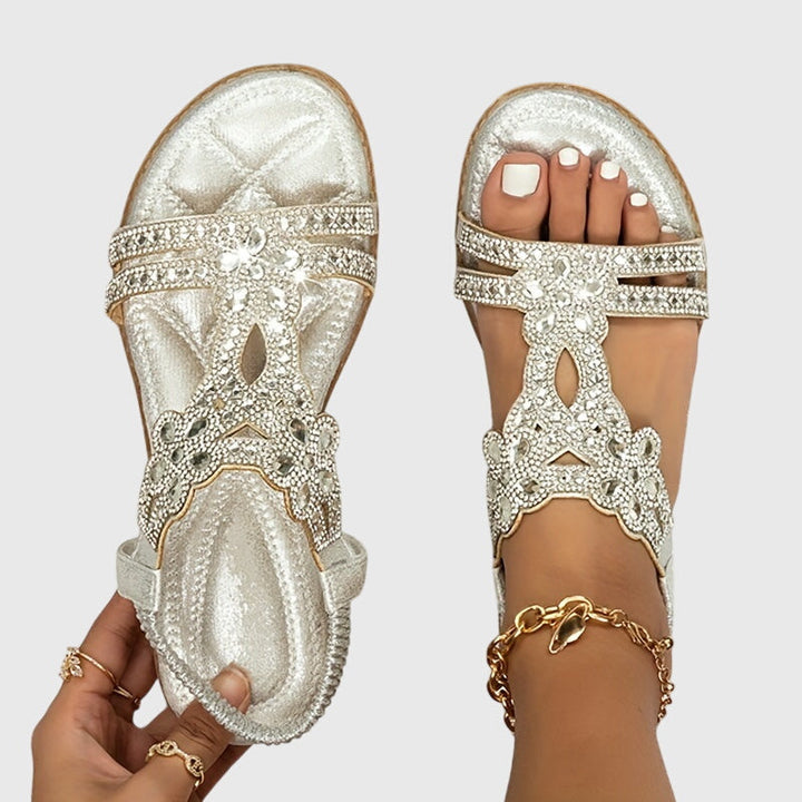 Elegant women's flat sandals, embellished with shimmering rhinestones.