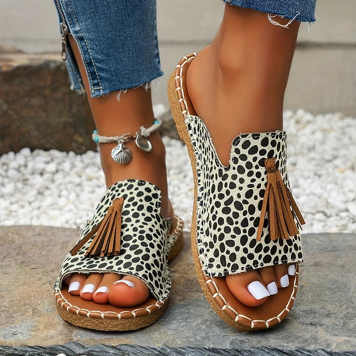 Stylish women's fashion flat sandals, a vibrant everyday footwear choice for summer outfits.