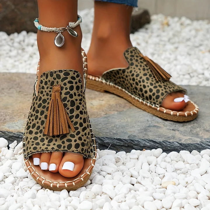 Easy slip-on women's flat sandals, offering comfort and style for casual summer footwear.