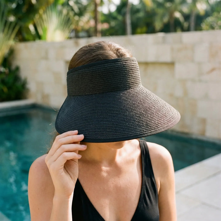 Women's roll-up sun visor hat, perfect for travel & beach. Adjustable open top design for summer vacation.