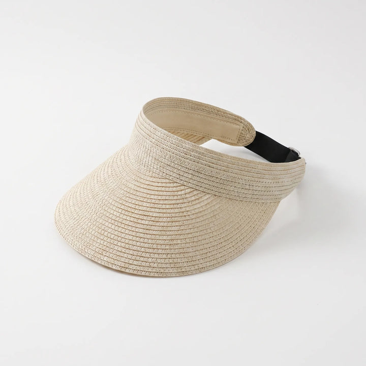 Lightweight women's roll-up sun visor, an essential summer travel hat. Adjustable open top for vacation comfort.