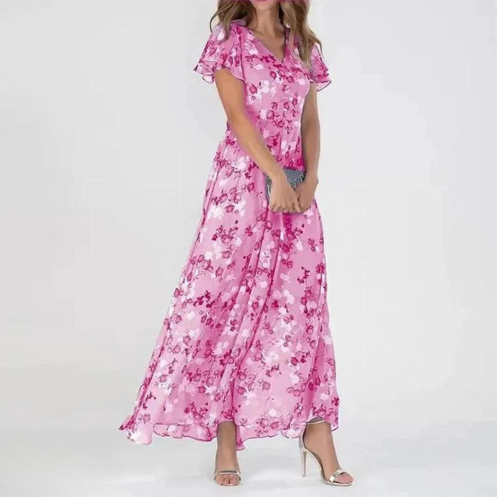 Elegant women's floral maxi dress featuring delicate flutter sleeves & a romantic print, ideal for special occasions.