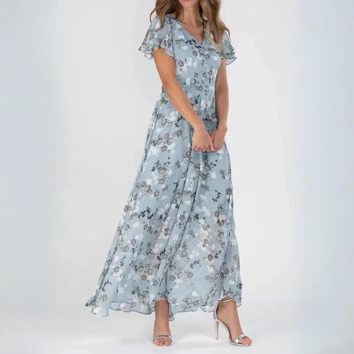 Flowy women's v-neck floral maxi dress with flutter sleeves, a chic choice for summer vacations & elegant events.
