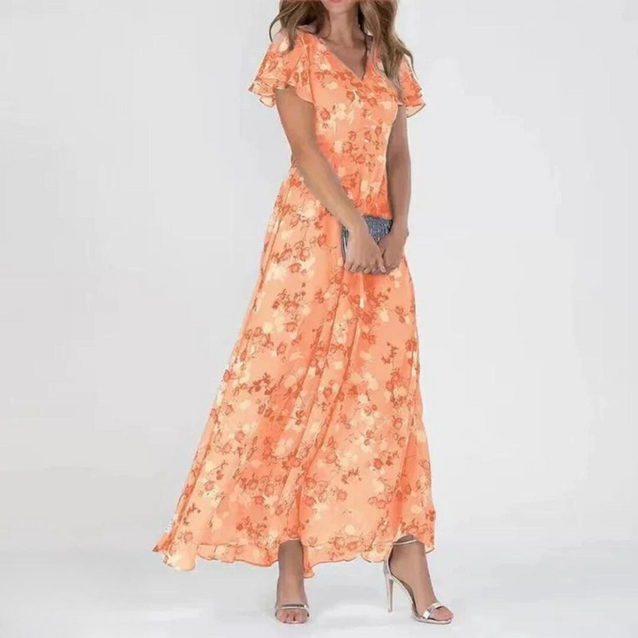Stunning women's long floral maxi dress with flutter sleeves, perfect as an elegant party or summer vacation outfit.