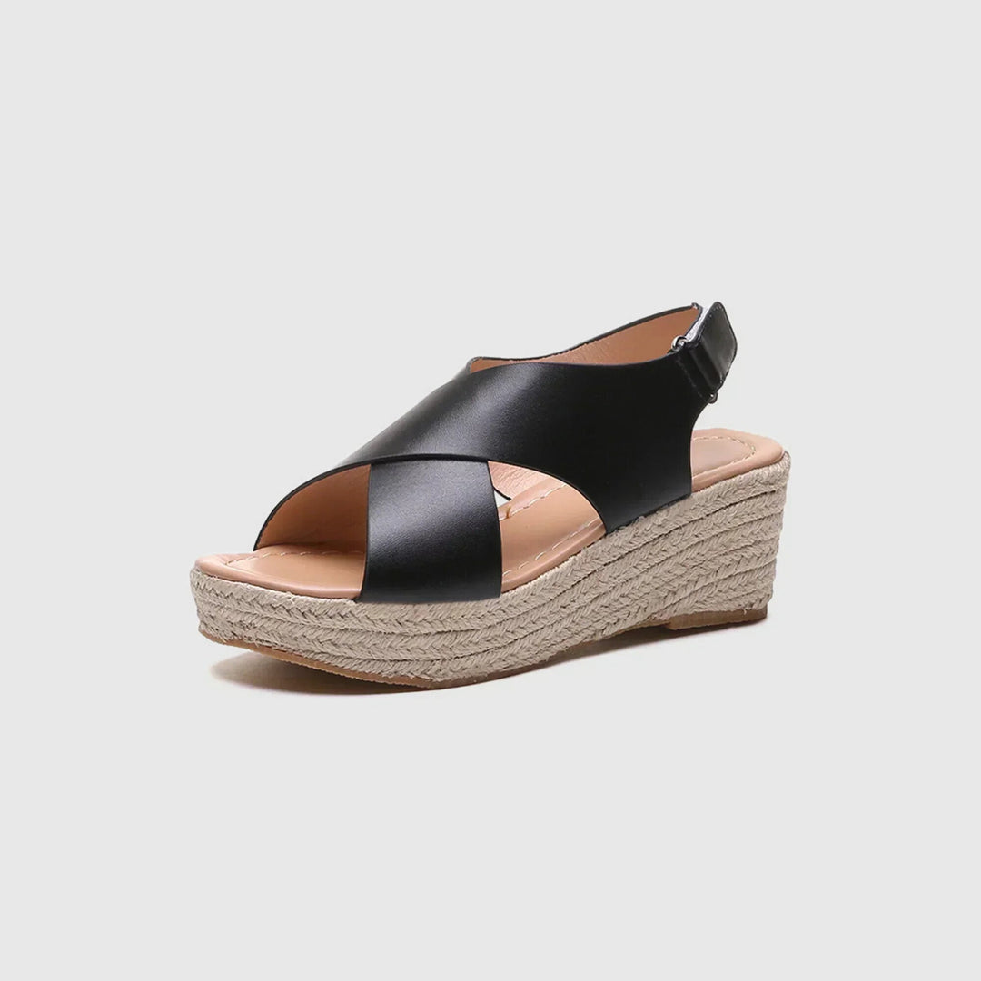 Detail shot of women's crisscross strap platform sandals, showcasing the stylish rope wedge.