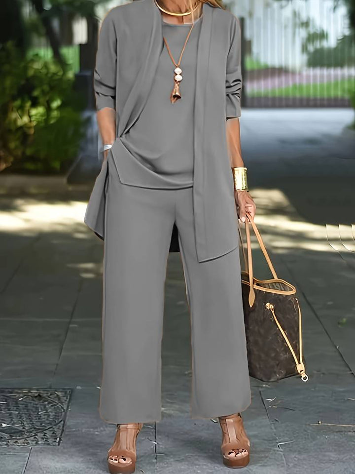 Soft women's 3-piece long sleeve lounge wear set with wide leg pants. Comfortable & versatile for casual fashion.