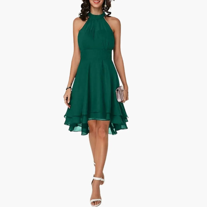 Detailed view of a chic women's knee-length ruffle dress, sleeveless, featuring a classic round neck design.