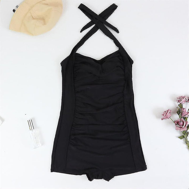 Dynamic women's ruched one-piece swimsuit, halter neck and boyleg cut, ideal for active beach days.
