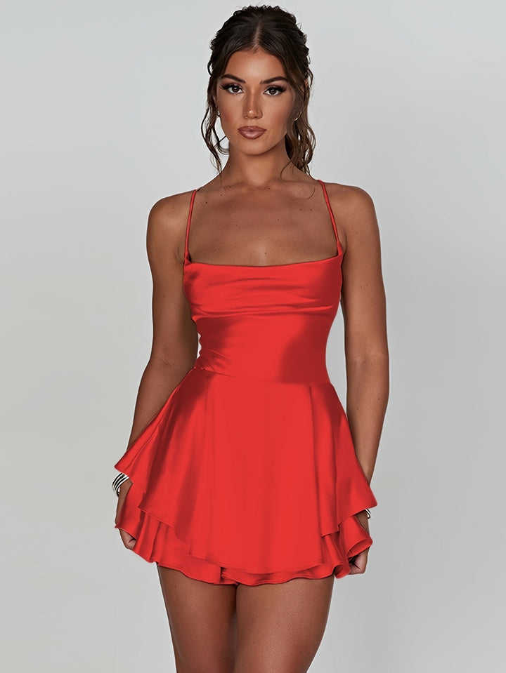 Party-ready ruched tiered mini dress with adjustable straps.