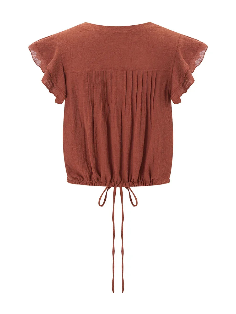 Casual women's cropped top with beautiful ruffles, perfect for sunny days.