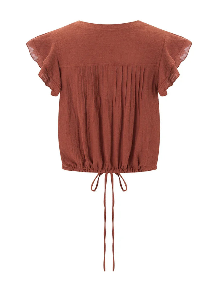 Casual women's cropped top with beautiful ruffles, perfect for sunny days.