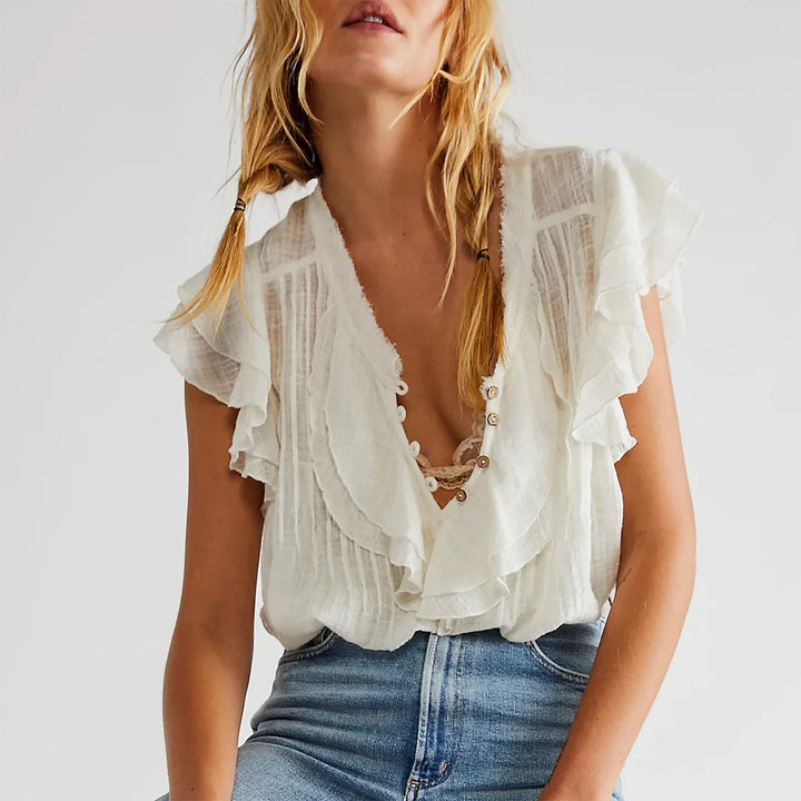 Effortless women's beach style crop top, featuring ruffles and a relaxed fit.