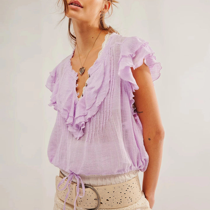 Women's button-front ruffle crop top, a stylish and comfortable summer essential.