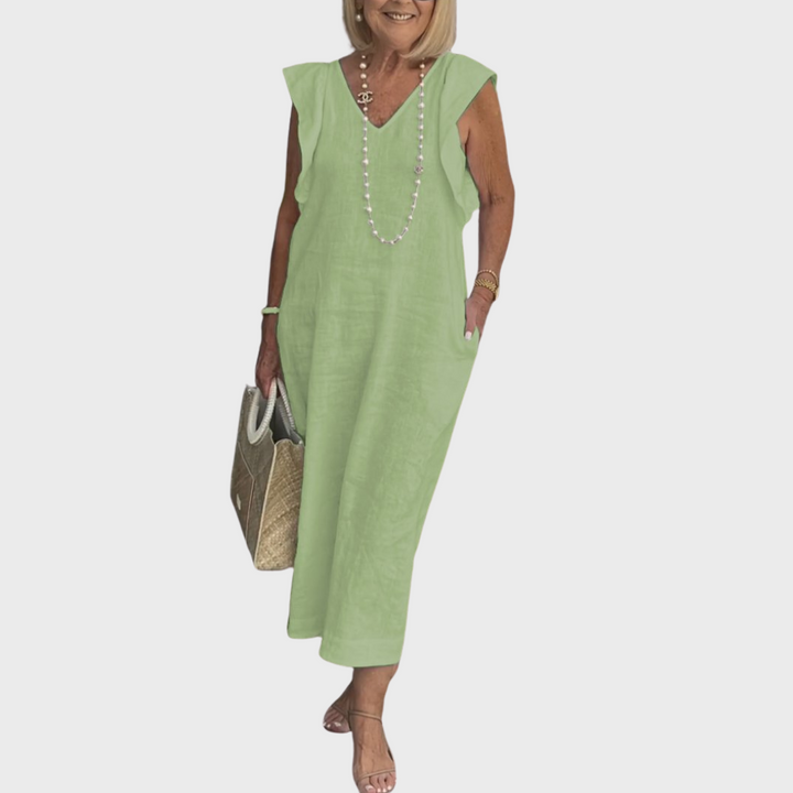 Comfortable & chic women's V-neck maxi dress with ruffle shoulders, sleeveless design, and functional pockets.