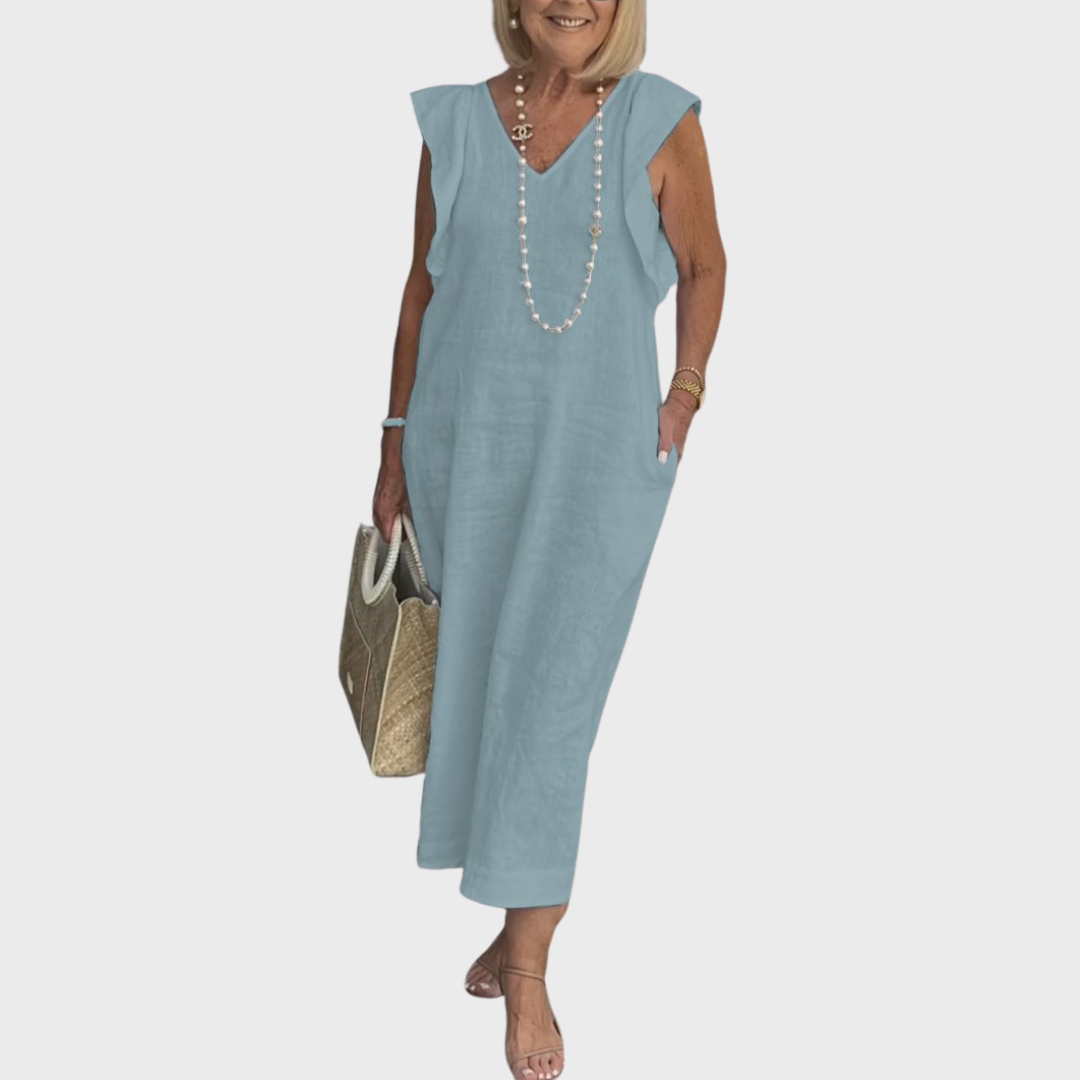 Stylish women's sleeveless V-neck maxi dress featuring ruffle shoulders, flowy fabric & handy side pockets.