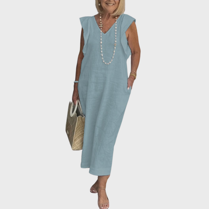 Stylish women's sleeveless V-neck maxi dress featuring ruffle shoulders, flowy fabric & handy side pockets.
