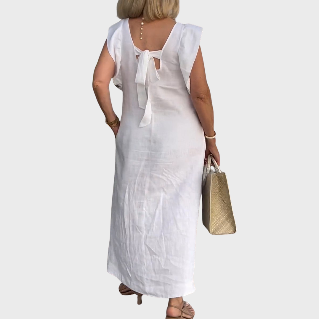 Comfortable flowy maxi dress for women, featuring ruffle shoulders, a V-neck, and convenient side pockets.